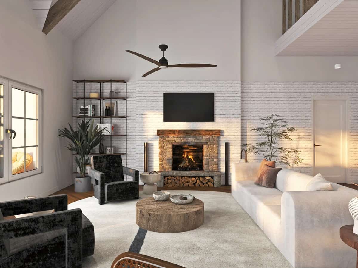 客厅里有现代风格的家具，一块米黄色的小地毯，一个金属搁架单元，以及一座石砌壁炉，壁炉顶部装有一台电视。