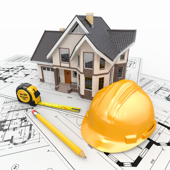 住宅与建筑师蓝图上的工具。
