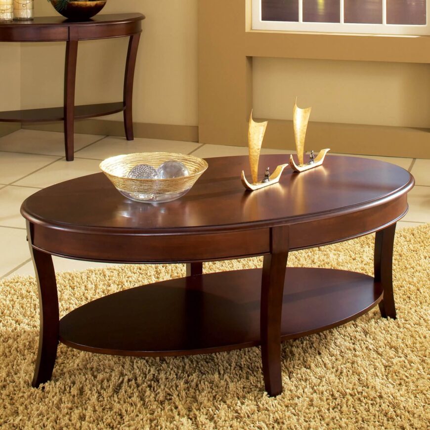 这一华丽的两层咖啡桌具有复杂的雕刻和光滑的宽表面。温暖的木质污渍有助于任何房间的流行。