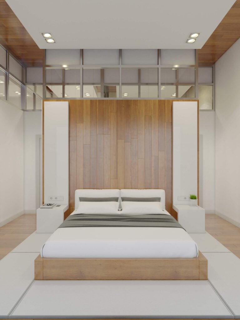 主卧室是一个对称的练习，在床后面有一个大的分隔墙兼作床头板。天然木框架安装在白色地板上。