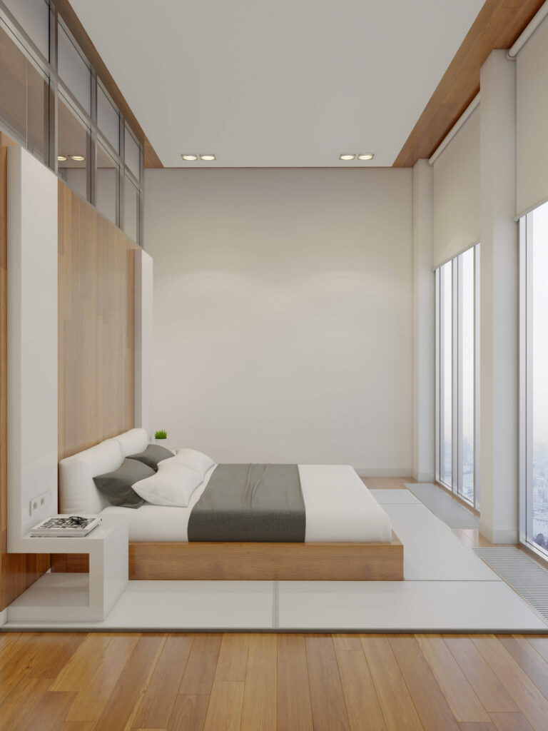 床面对着一对通高的窗户，为主卧室创造了一个巨大的开放视觉空间。