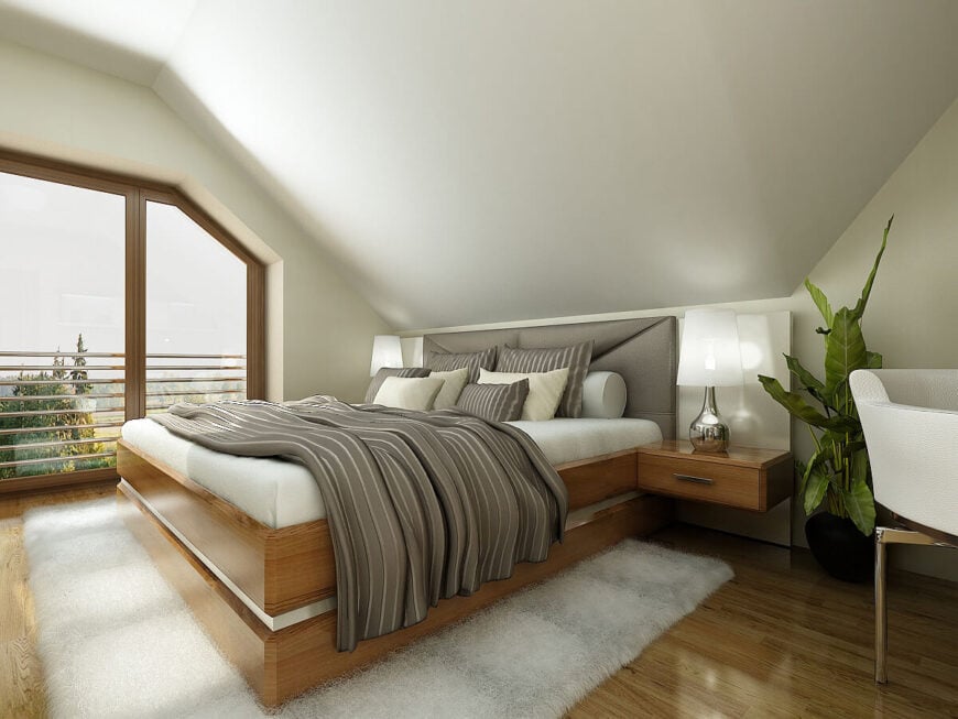 第二间卧室采用了与第一间卧室相同的大胆纹理，采用了浅色的配色方案和带垫的床头板。