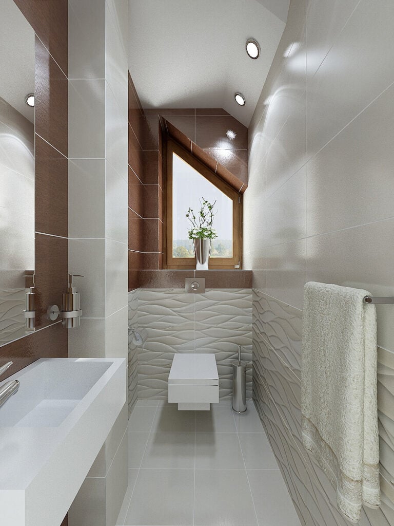 第二间浴室有厕所和水槽。有质感的红棕色瓷砖与主卧室和浴室木材的颜色相匹配。