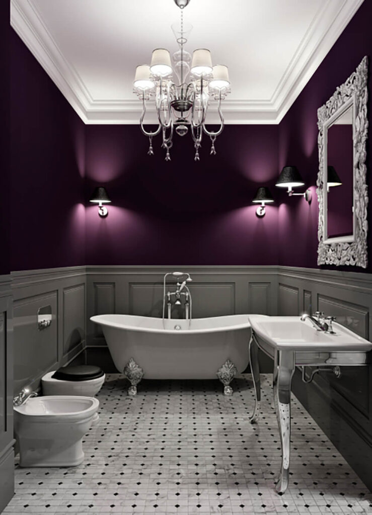 深紫色的墙壁和黑色的灯罩使这个空间保持黑暗和放松。沿墙下半部分的面板以深灰色的色调保持空间的平静，地板上的瓷砖增加了细节元素。