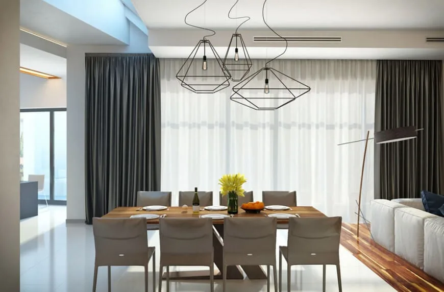 现代与时尚的餐厅餐桌设置由一套华丽的天花板灯点亮。