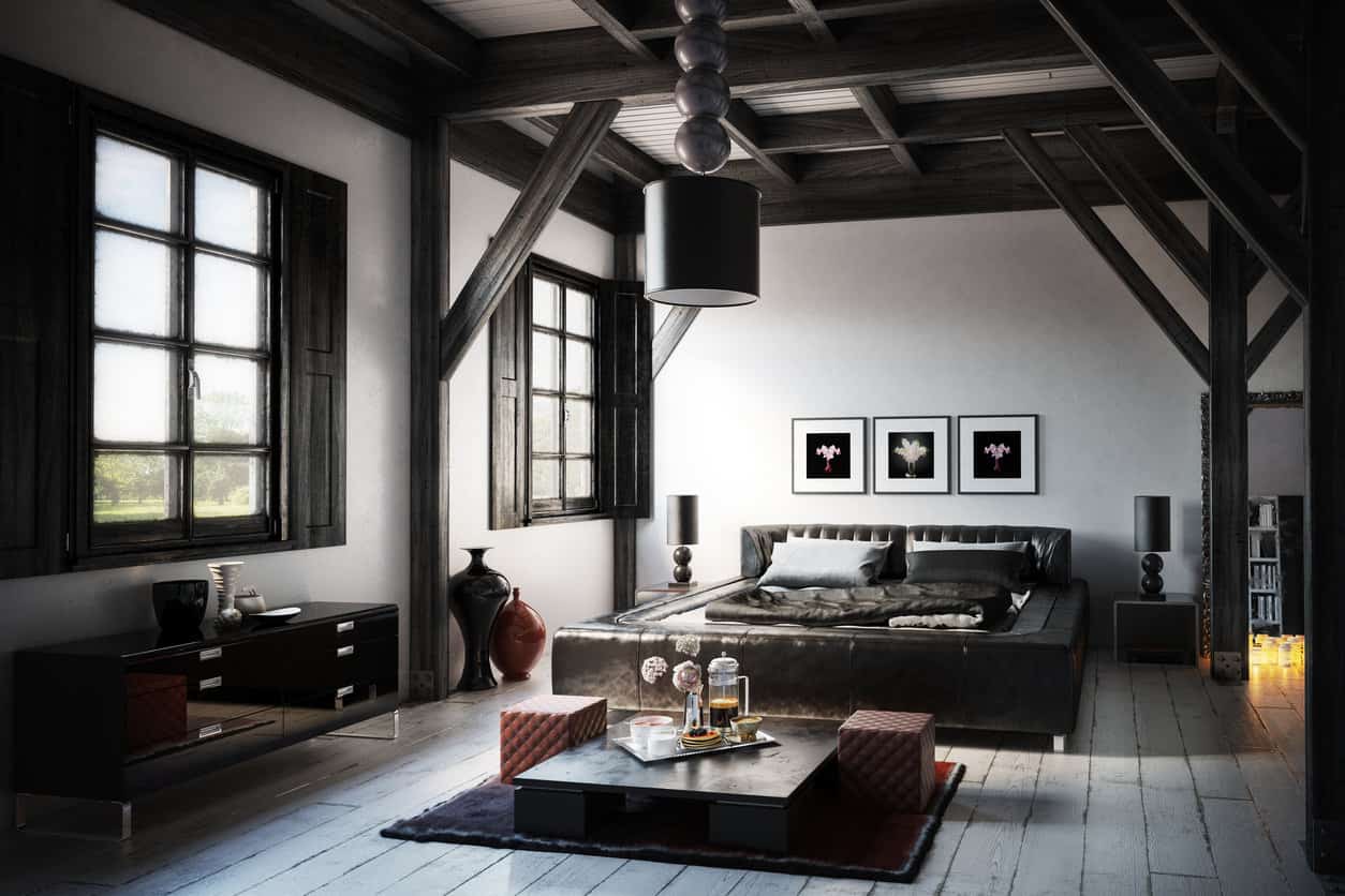 非常男性化的现代主卧室设计(渲染)，深色的天花板横梁和浅色木地板上的装饰。家具包括黑色台床。