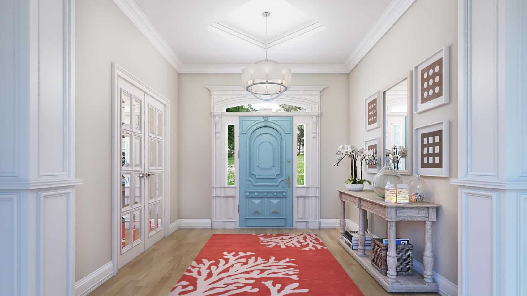 中性的门厅强调了淡蓝色的门和红色的跑道，铺设在硬木地板上。它的设计是极简主义的墙壁艺术，白色的镜子安装在浅灰色的墙壁上。