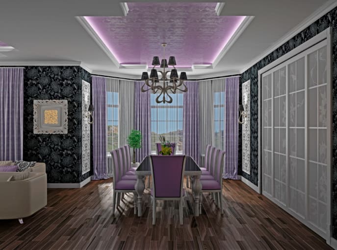 一个豪华的用餐区，拥有优雅的黑色装饰墙壁和令人惊叹的托盘天花板。房间以紫色为基调，为该地区增添了优雅。
