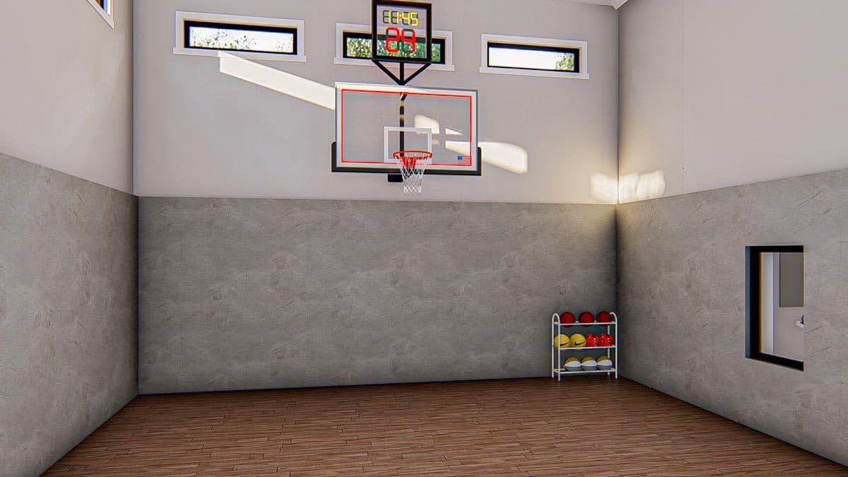 体育法庭硬木地板和深浅不一的墙壁安装一个篮球戒指。