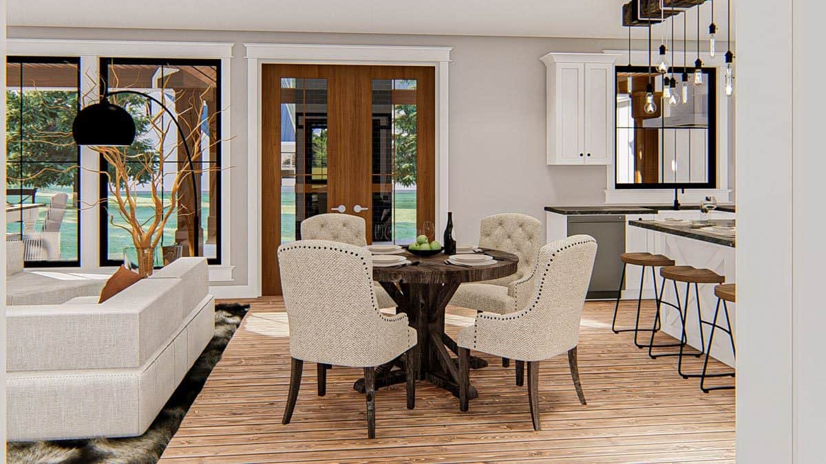 早餐区设有圆形餐桌和米色簇绒椅子。它位于厨房和客厅之间。