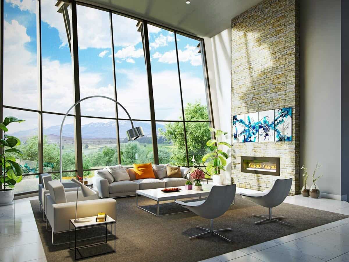 客厅设有现代座椅，石壁炉，落地玻璃窗俯瞰室外风景。
