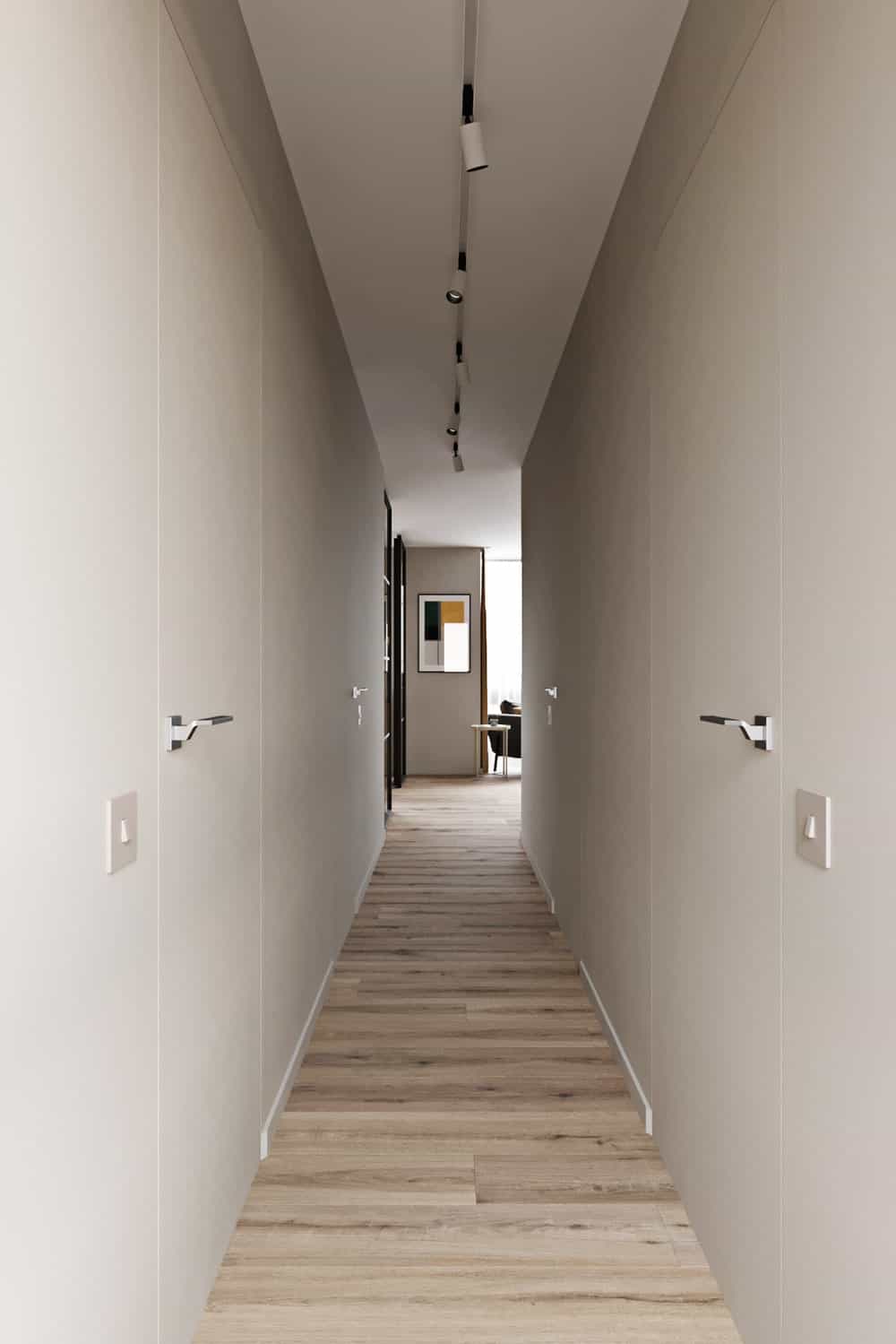 这是狭长的走廊，浅色硬木地板，浅米色的墙壁与门融合得很好。
