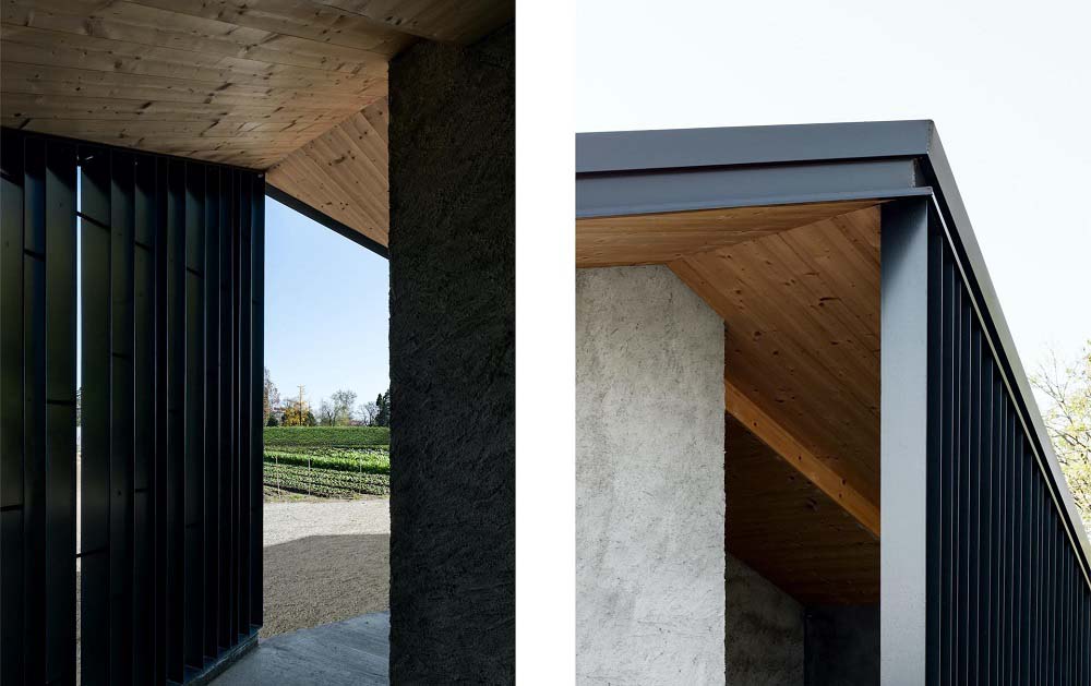 这个近距离的双重外观展示了房子一侧的木质天花板以及金属梁。