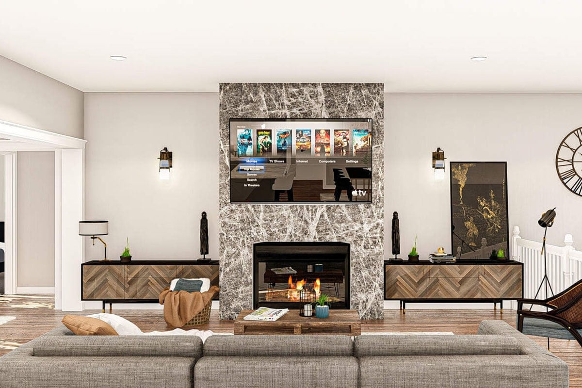 客厅与灰色的截面,固定在墙上的电视,和一个壁炉两侧雪佛龙表。