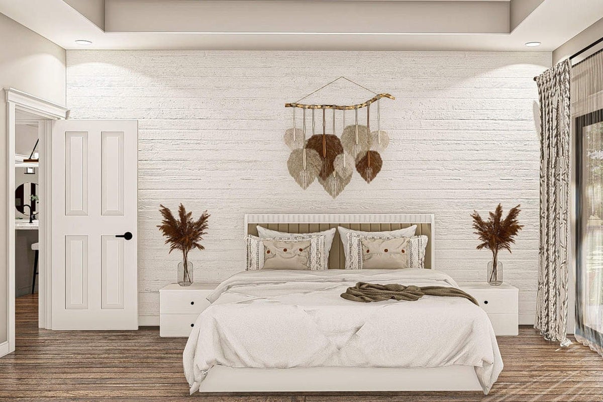 主卧室有白色的家具,实木地板,纹理口音墙饰以流苏花边。