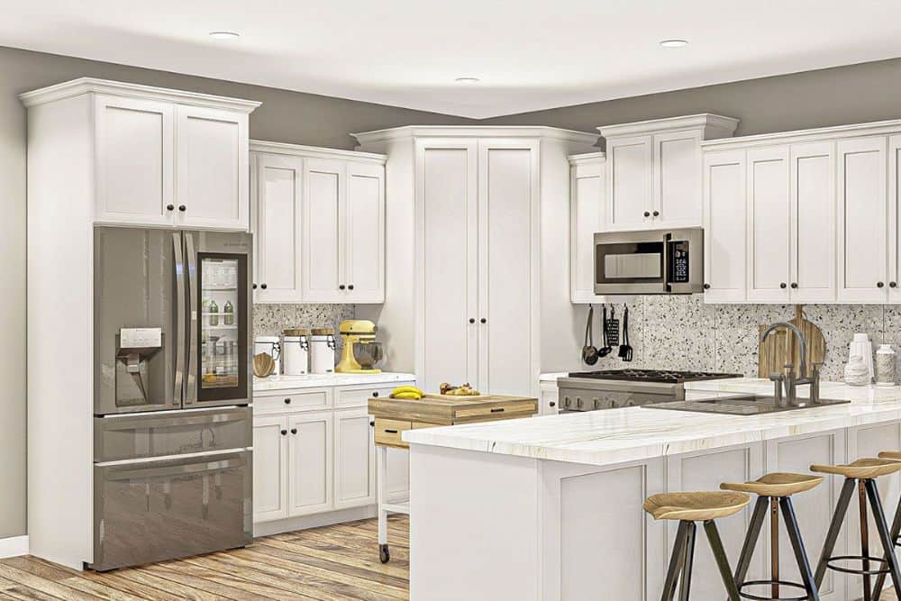 厨房配有石板电器，大理石台面，白色橱柜，角落的食品储藏室和早餐吧。