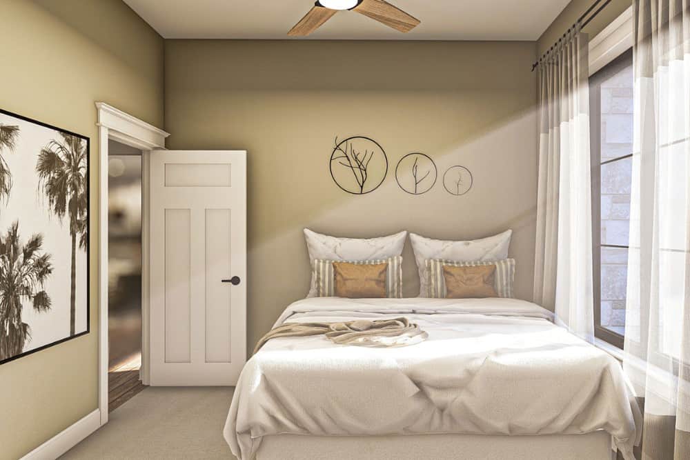 卧室有灰褐色的墙壁和一扇大窗户，允许自然光线进入。