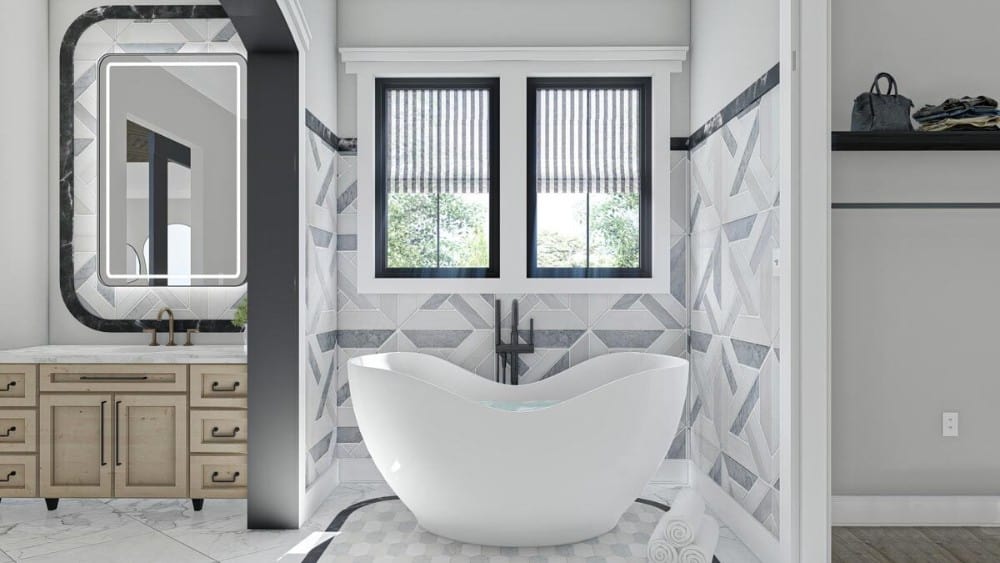 独立浴缸上方的几面镜框镜子将自然光引入主浴室。