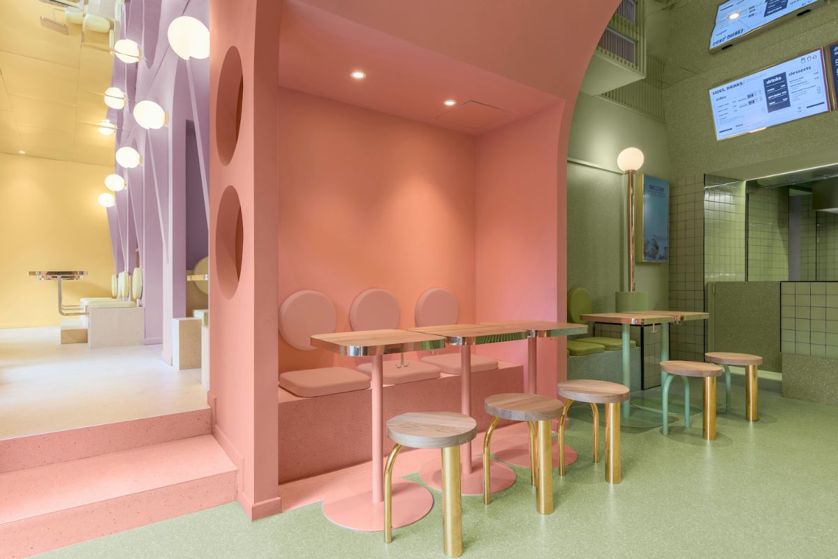用餐区，使用面包家具和照明，突出三种不同的用餐区颜色，桃子，地球绿色和紫罗兰色。