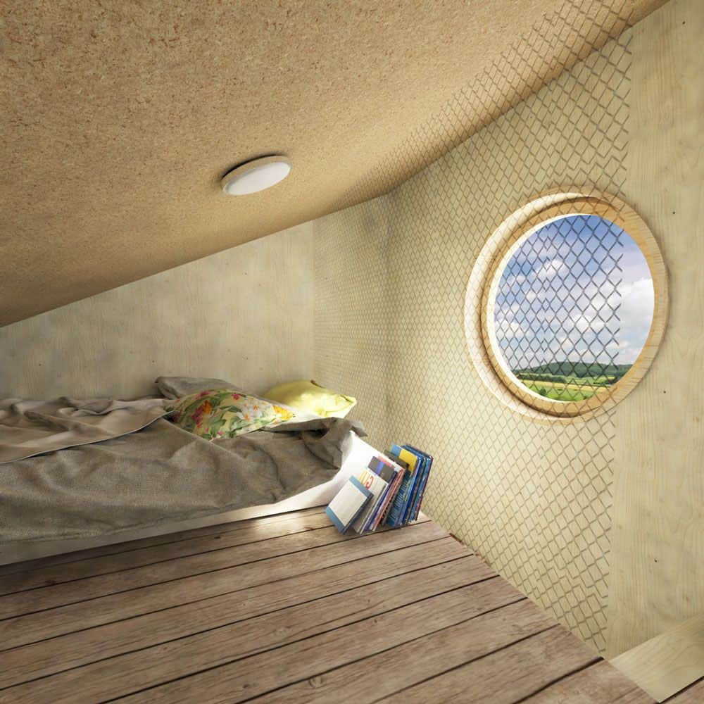 卧室里有带棚的天花板，宽大的木板地板，还有一面能把自然光引入室内的大圆镜。