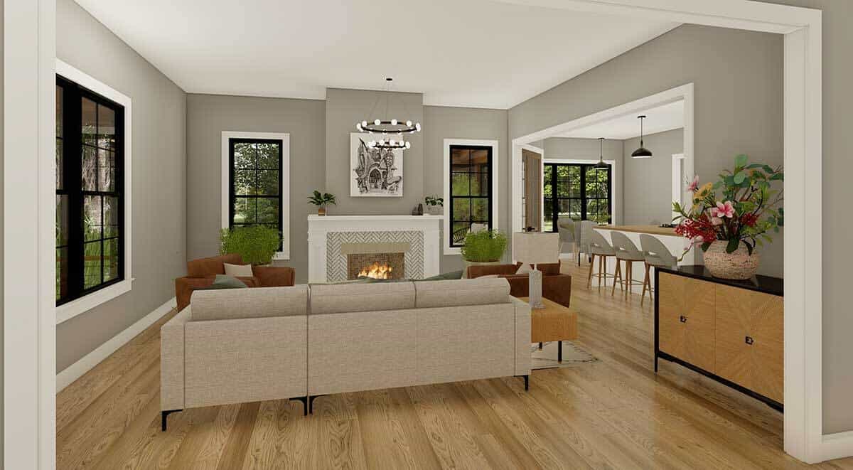 客厅里有一个米色的沙发，棕色的扶手椅和一个舒适的壁炉。