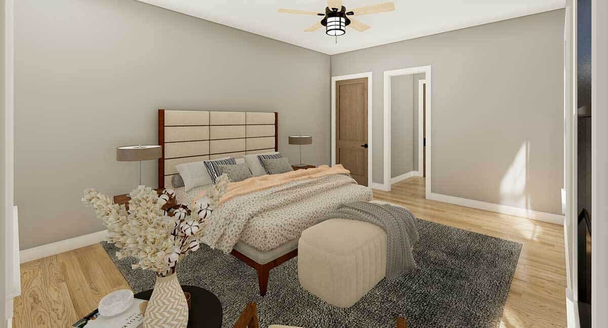 主卧室铺着浅色硬木地板，灰色墙壁上点缀着白色装饰。