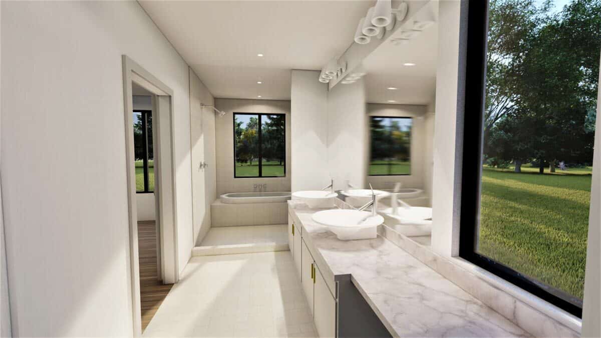从主浴室也可以看到后院，主浴室配有双水槽梳妆台和一间带花园浴缸的湿房。
