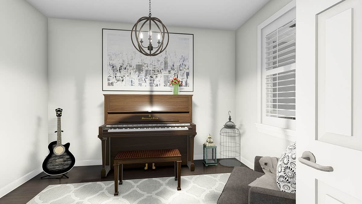 音乐室里有一把灰色扶手椅、一把吉他和一架由球形吊灯照亮的立式钢琴。