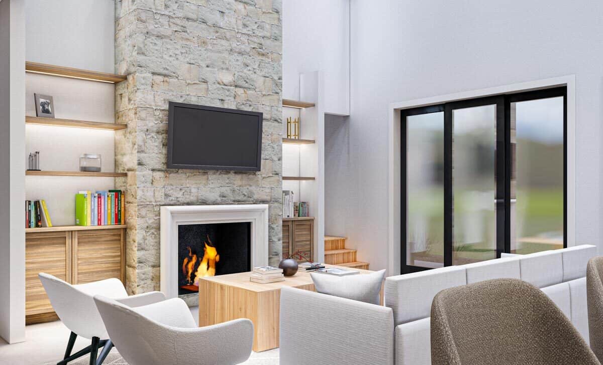 大房间,灰色现代座椅,安装在墙上的电视,和一个壁炉依偎在木制的整体功能。
