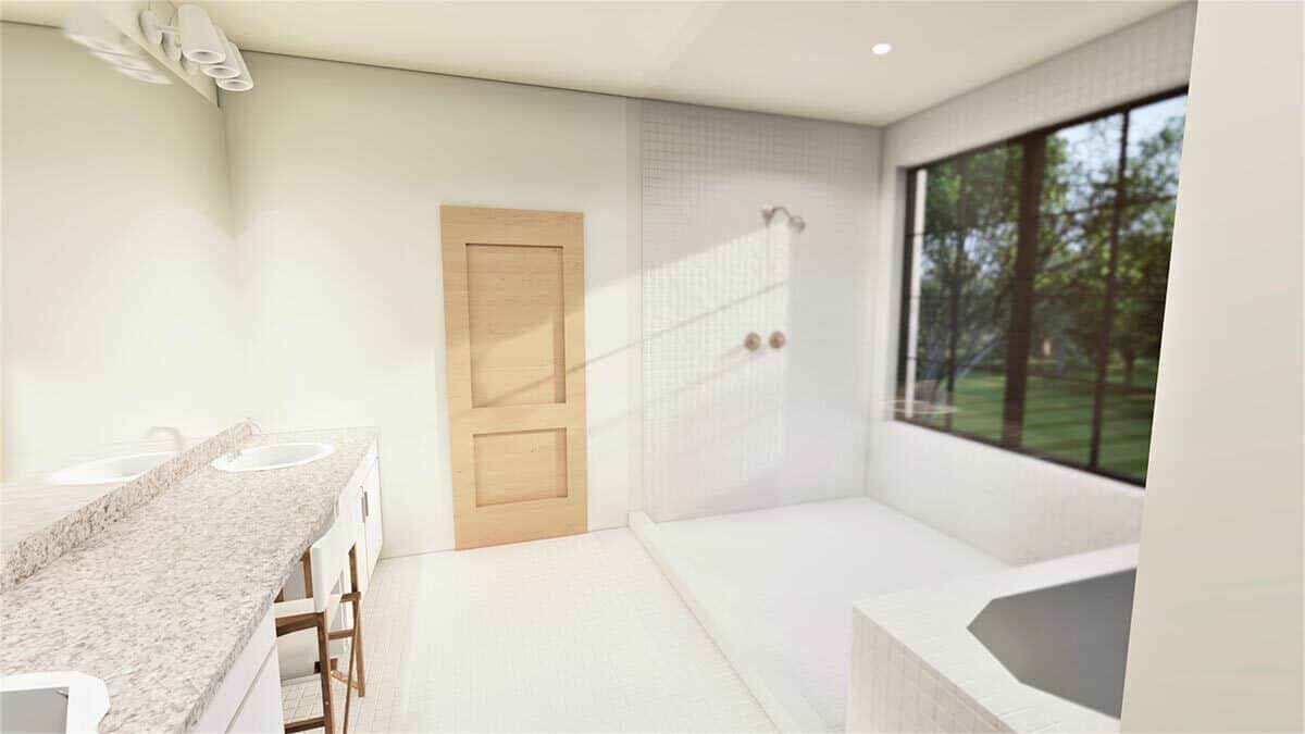 主浴室有一个双洗手池梳妆台，一个深泡浴缸，和一个步入式淋浴间，由一扇大窗户照亮。