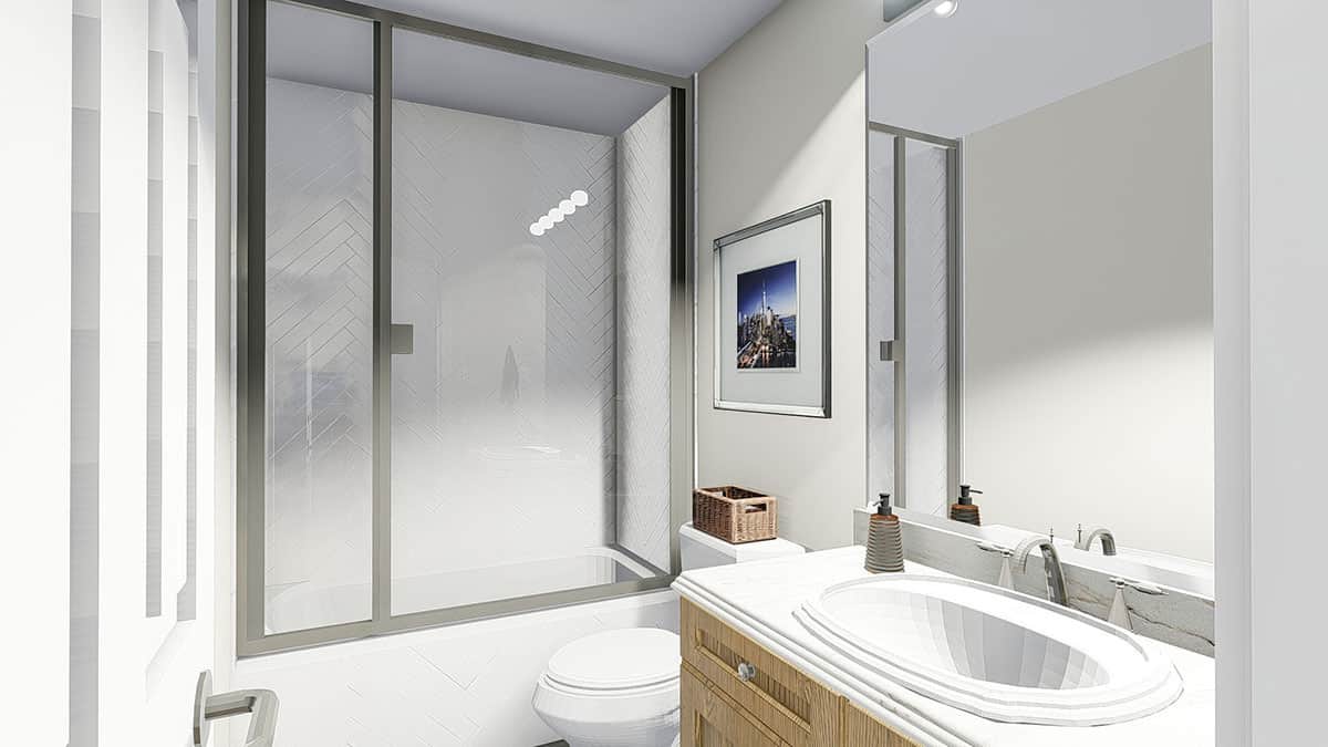 这浴室充满水槽虚空,一个厕所和一个浴缸和淋浴组合封装在一个滑动玻璃门。