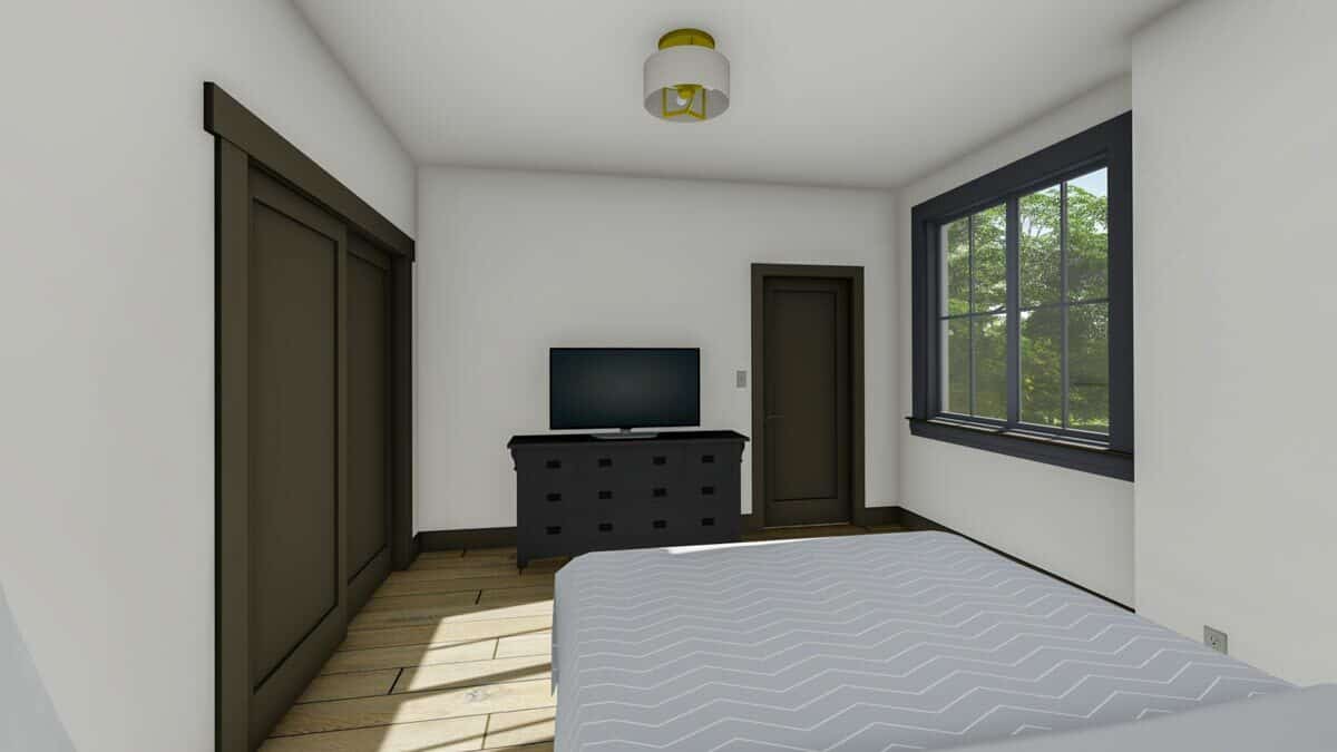 这间卧室模仿了第二间卧室，有深色的木制家具、电视和宽阔的木板地板。