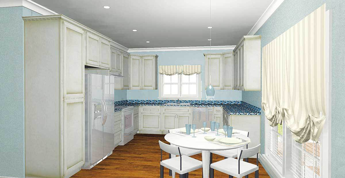 就餐式厨房有一套圆形餐厅、白色橱柜、浅蓝色墙壁和硬木地板。