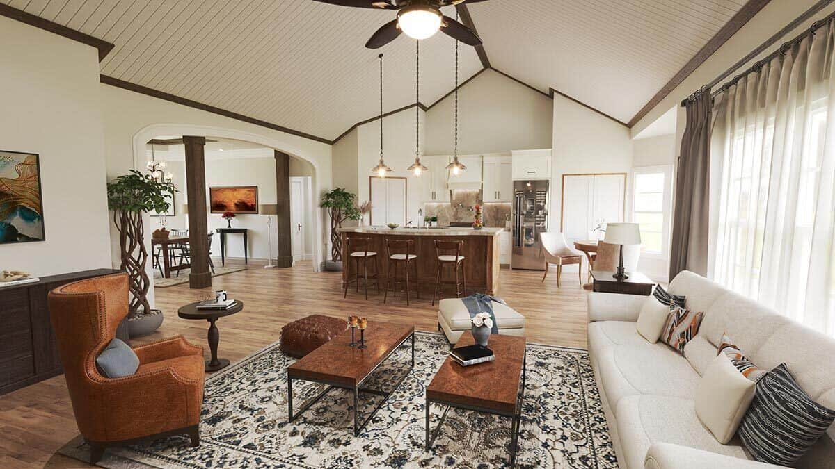 拱形天花板下的客厅、厨房和早餐角的开放式布局视图。
