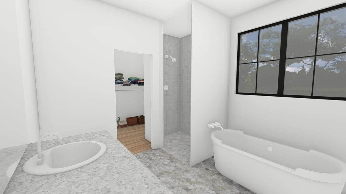 主浴室有一个大梳妆台，一个步入式淋浴间和一个独立的浴缸，顶部有框窗。
