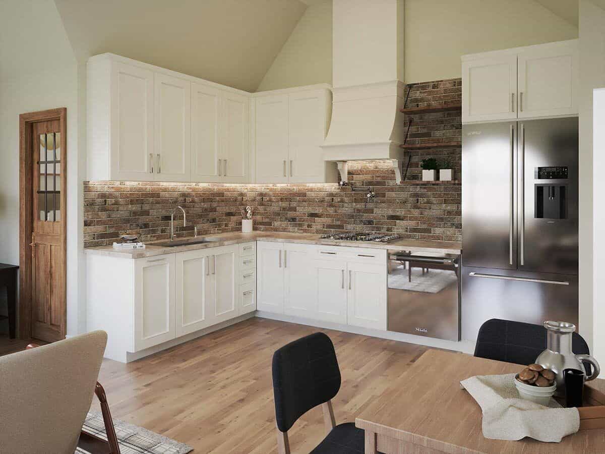 砖砌的后挡板为白色厨房带来了质感。
