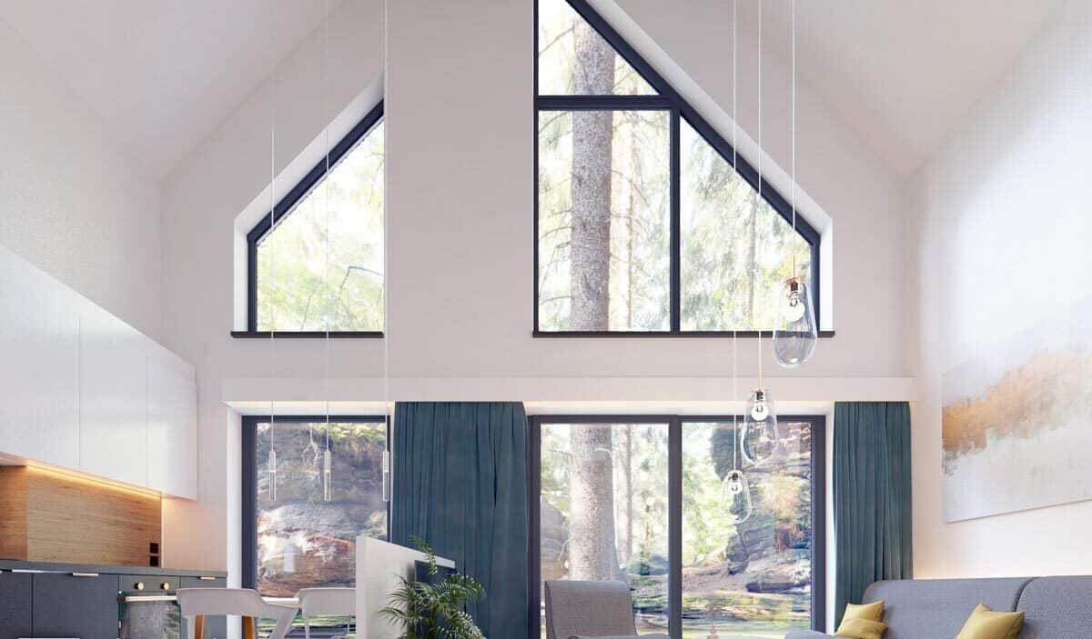 巨大的窗户和拱形天花板增强了开放生活空间的光线和空气的感觉。