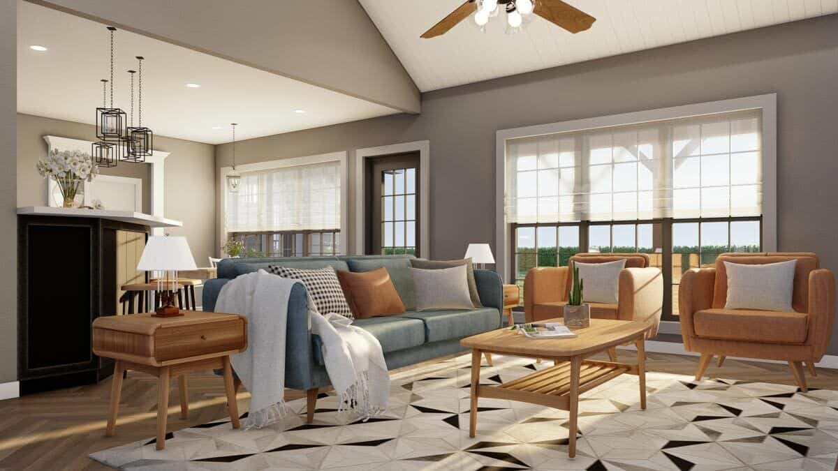 客厅里有现代化的座椅、木桌和铺在拼花地板上的有图案的区域地毯。