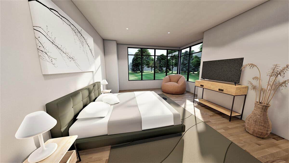带电视的主卧室，一张光滑的平台床，以及角落窗户旁的休息区。