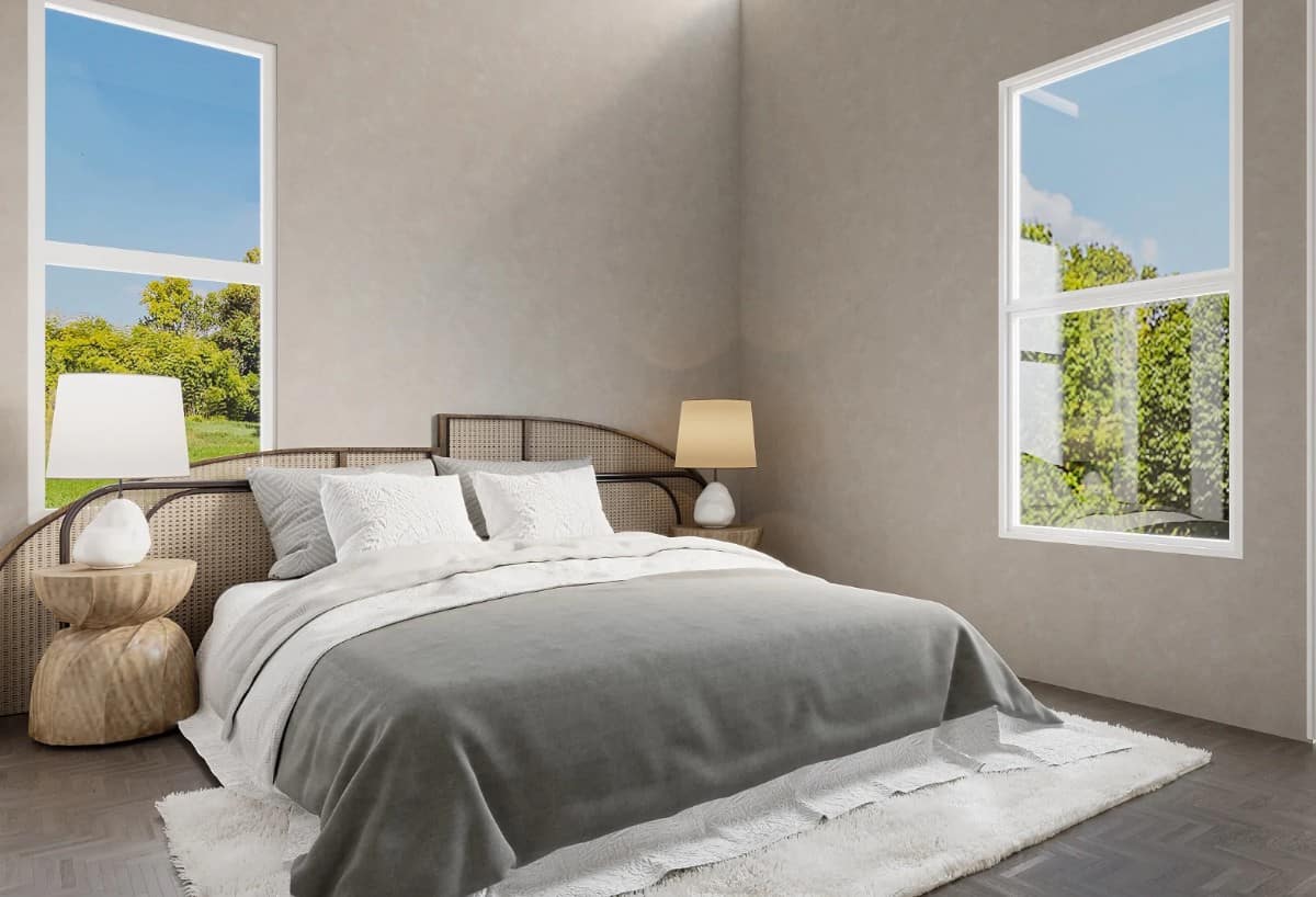 这卧室功能灰褐色的墙和一个舒适的床上与一个定制的藤床头板。