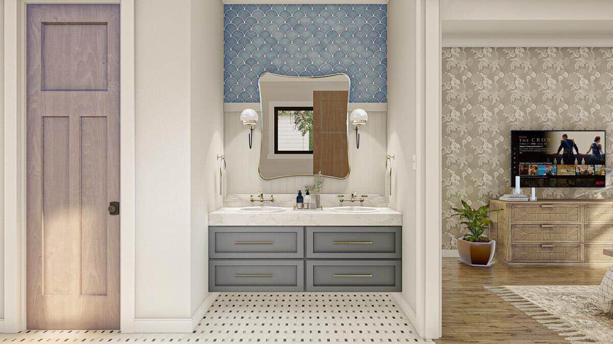 主浴室设有一个浮动梳妆台，配有两个水槽、大理石台面和一面装饰性镜子。