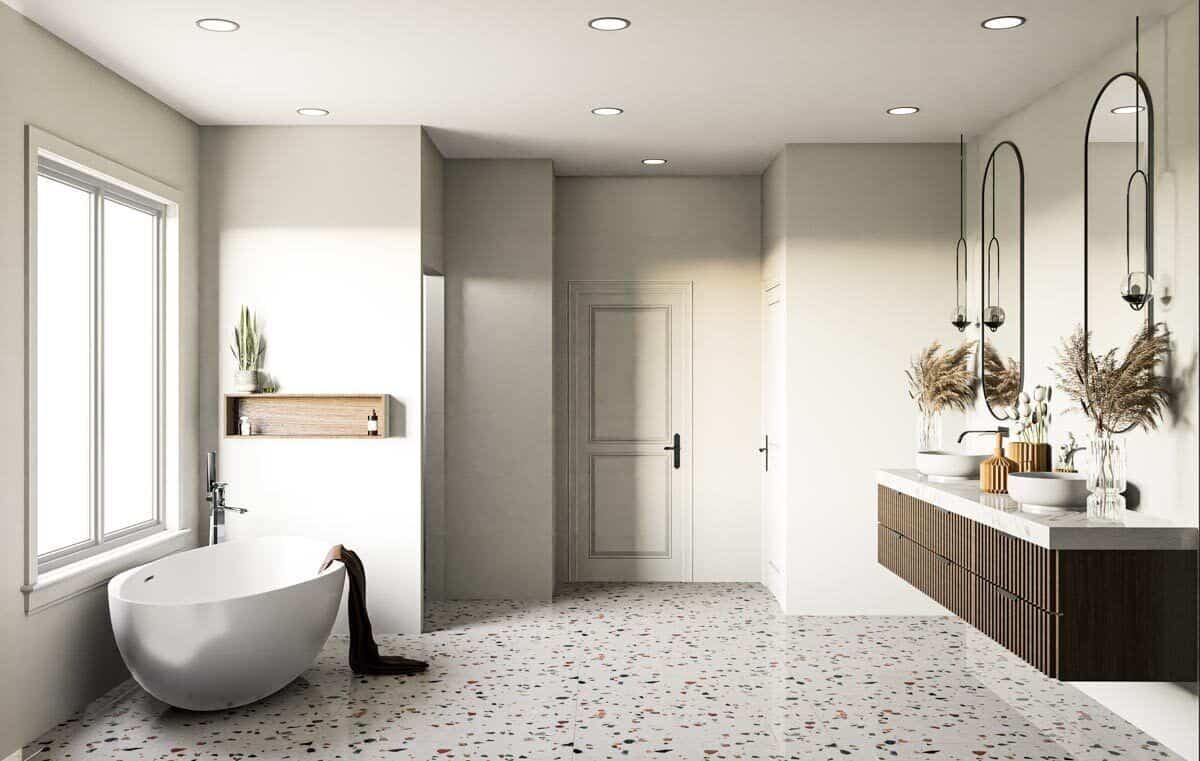 主浴室设有独立浴缸和浮动梳妆台，配有大理石台面，双水槽和椭圆形镜子。