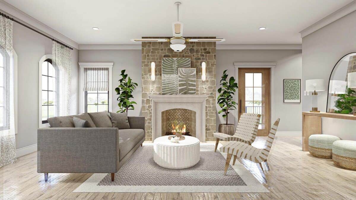 石头壁炉用树叶装饰艺术品和圆柱形烛台温暖的客厅。