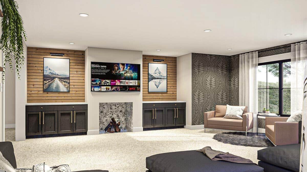 家庭娱乐室提供舒适的座位，一个大电视，和一个壁炉两侧的基础橱柜。