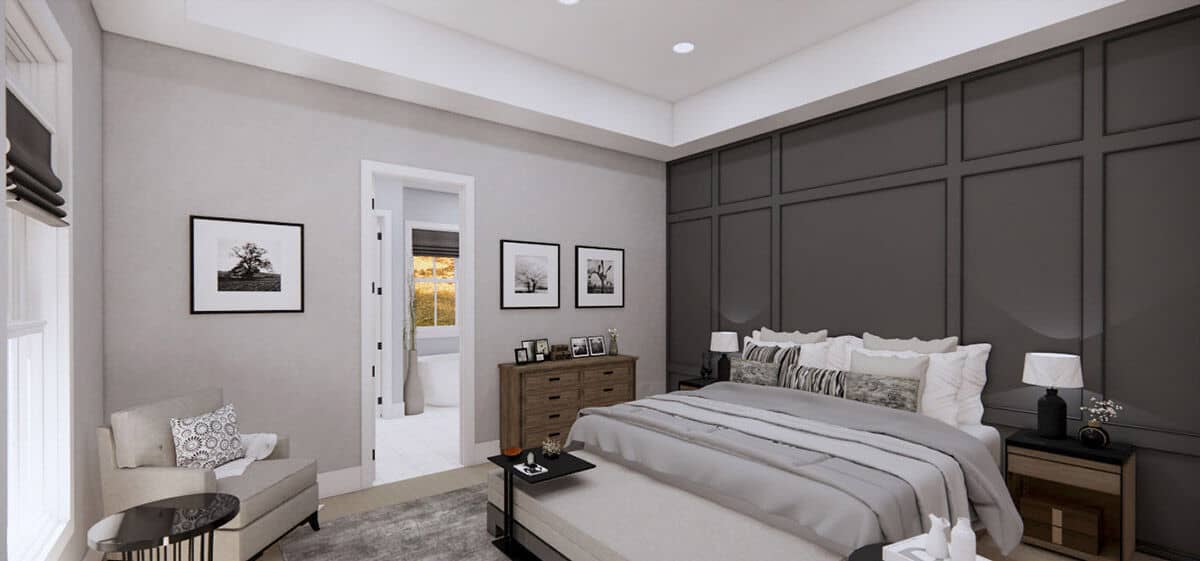 主卧室的特色是灰色的壁板强调墙，为舒适的床设置了一个很好的背景。