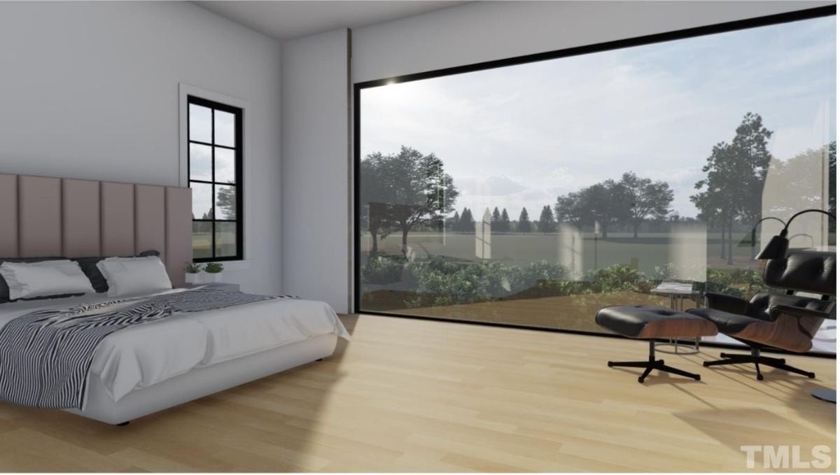 卧室设有一张双人床和一个全尺寸的玻璃窗，可以看到外面的风景。