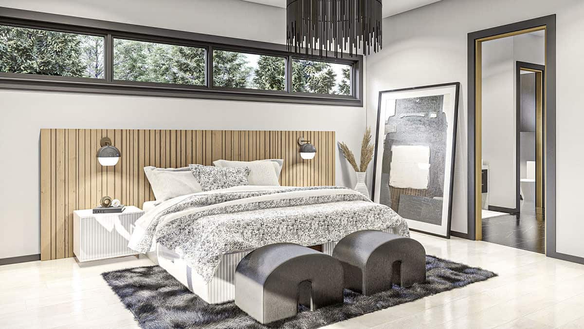 床的定制床头板上方的天窗将自然光引入主卧室。