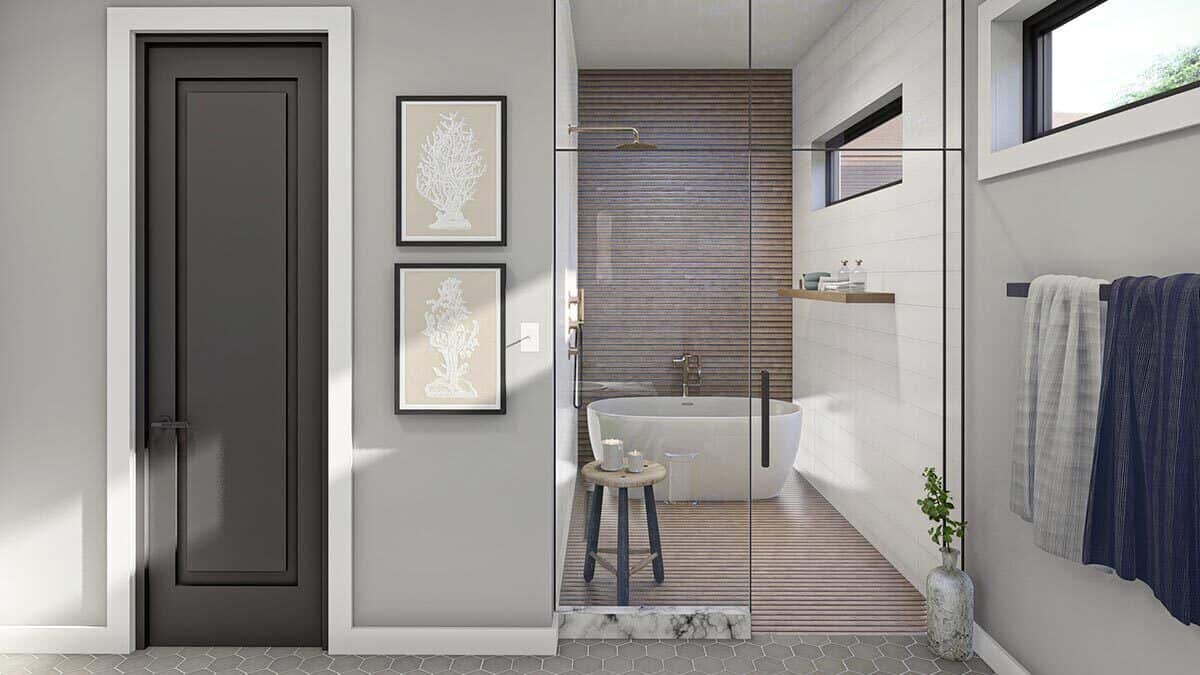 主浴室设有一间带有镀铬淋浴间和一个独立浴缸的湿房，该浴缸通过一扇天窗采光。